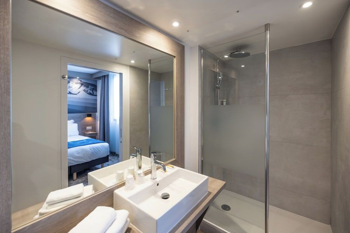 Bathroom | Shower, rainfall showerhead, hair dryer, towels