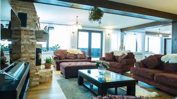 Flat-screen TV, fireplace, pay films