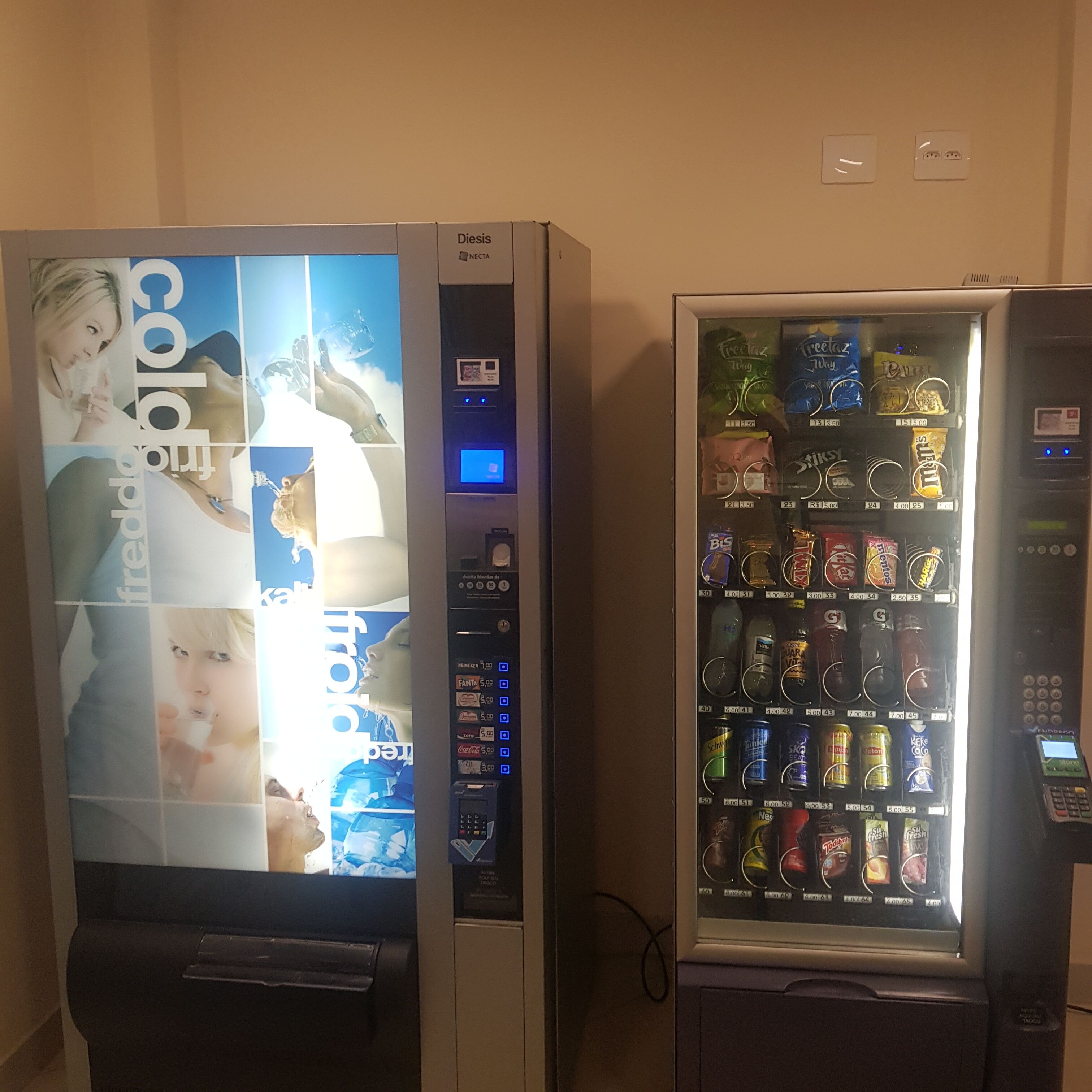 Two vending machines with a variety of snacks and drinks.