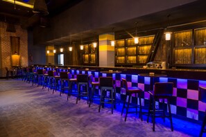 A bar area with a checkered pattern, bar stools, and pendant lighting. - Pickalbatros Sea World Resort - Marsa Alam- "Aqua Park" (El Quseir)