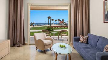 Junior Suite, Beach View | Minibar, in-room safe, blackout curtains, soundproofing