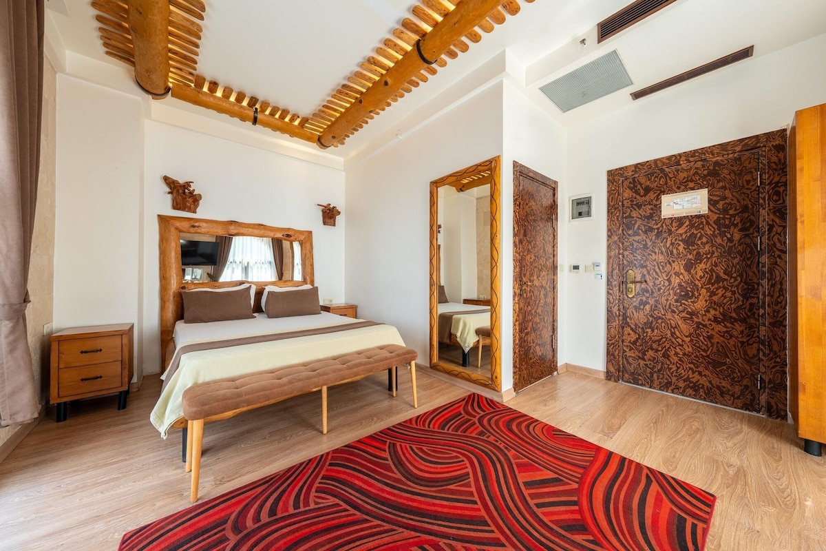Premium bedding, desk, laptop workspace, soundproofing