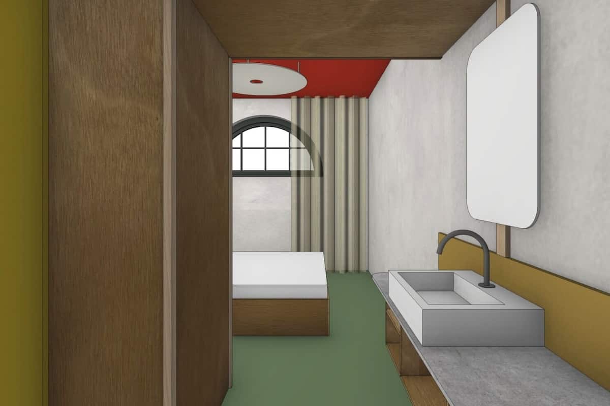 Una habitación pequeña con cama, lavamanos y espejo.