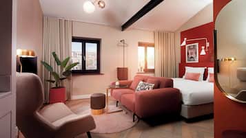 Junior Suite | Living area | Flat-screen TV, toys