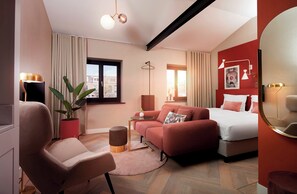 Junior Suite | Living area | Flat-screen TV, toys