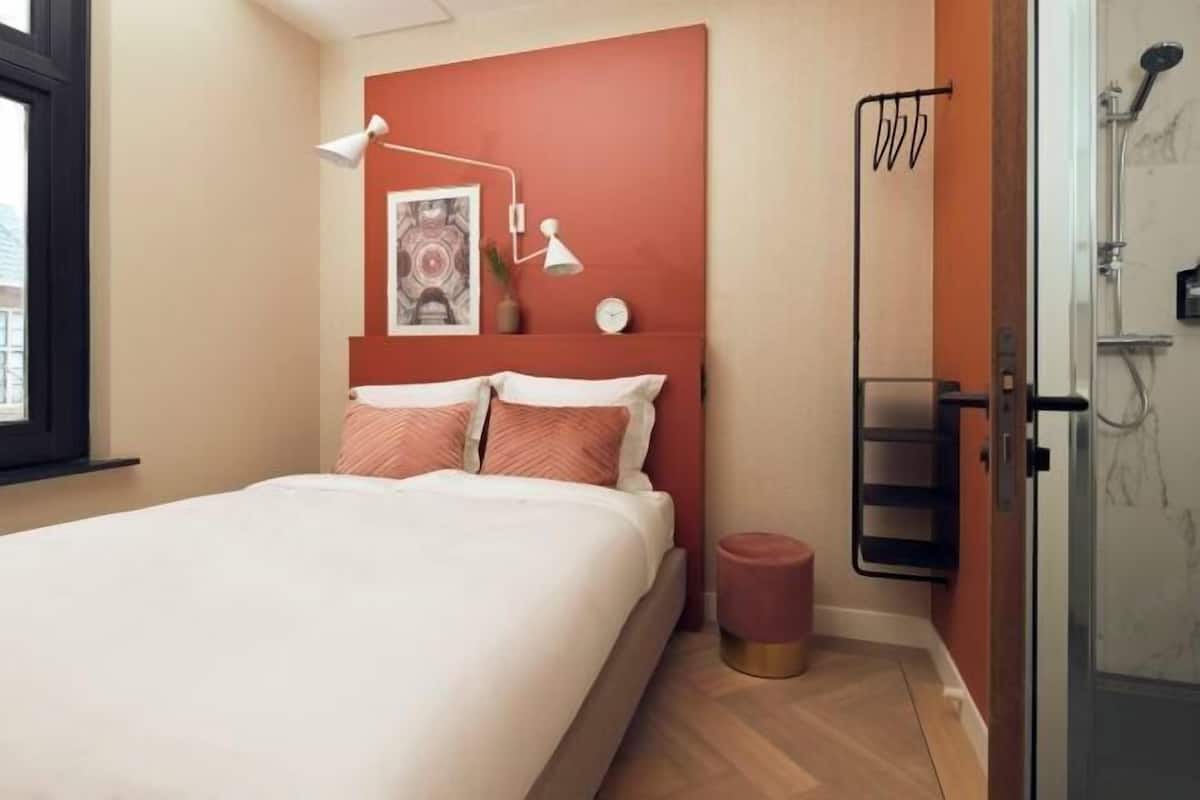 Premium bedding, blackout curtains, soundproofing, iron/ironing board