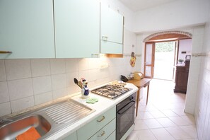 Apartment | Private kitchen | Full-size fridge, oven, stovetop, coffee/tea maker