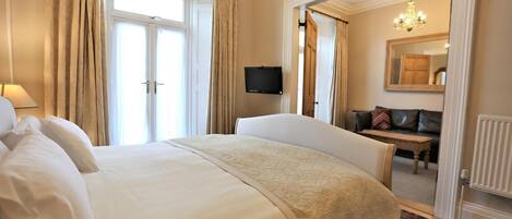 Luxury Suite, 1 Bedroom, Ground Floor. Balcony access with large bathroom. | 1 bedroom, Egyptian cotton sheets, premium bedding, down comforters