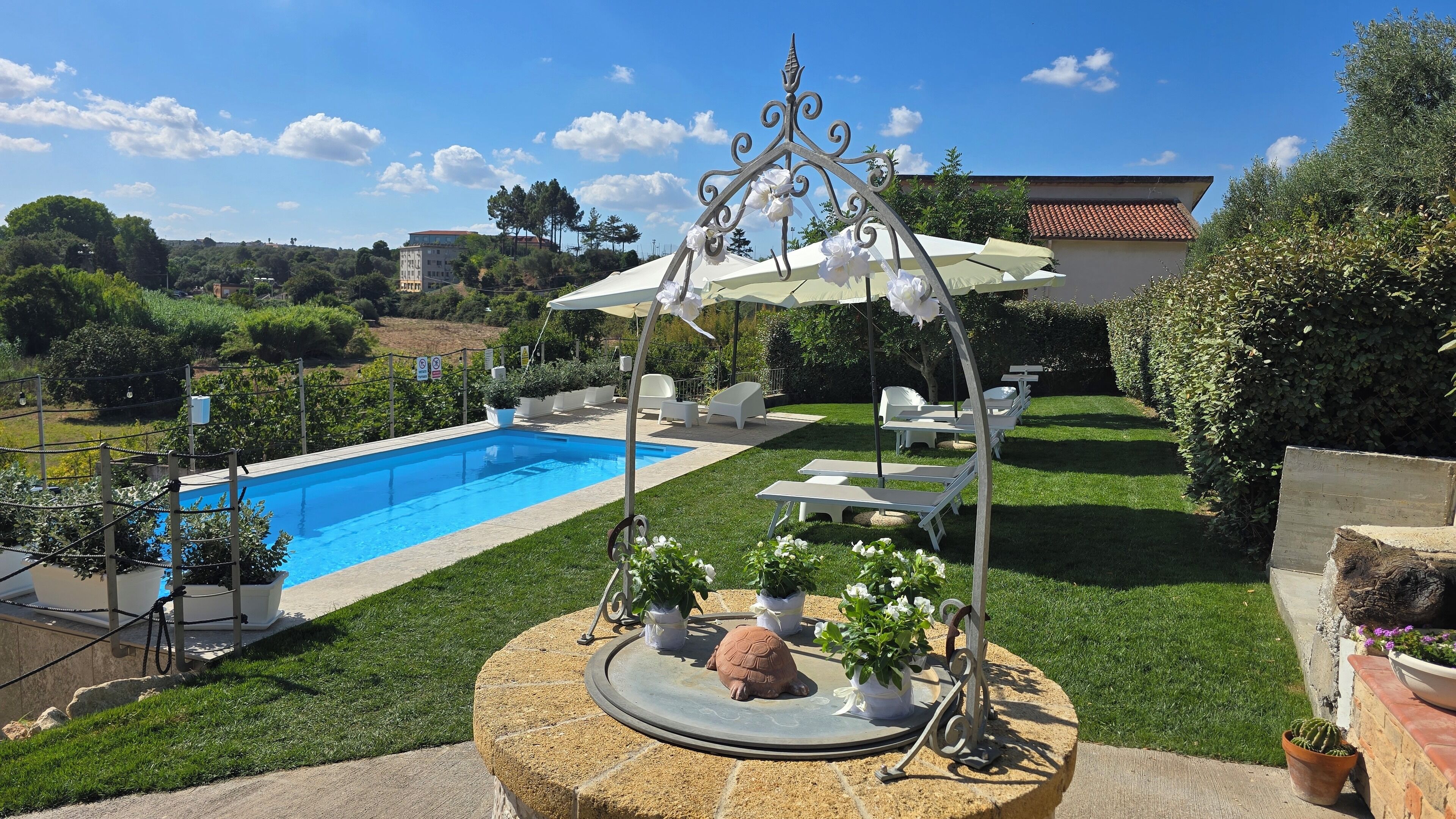 Seasonal outdoor pool, open 8:30 AM to 8:00 PM, pool umbrellas