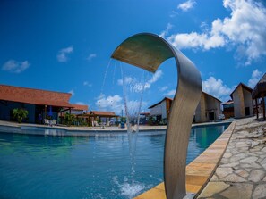 Indoor pool, outdoor pool, pool umbrellas, pool loungers