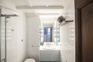 Bathtub, hair dryer, towels, soap