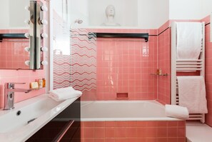 Bathtub, hair dryer, towels