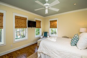 A bedroom with a bed, a ceiling fan, a chair, and a TV mounted on the wall. - WaterColor Beach Home w/ Resort Amenity Passes, Sleeps 8 + Free Tickets! (Santa Rosa Beach)