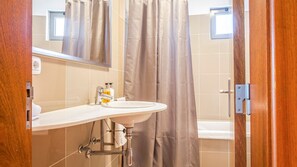 Bathtub, hair dryer, towels