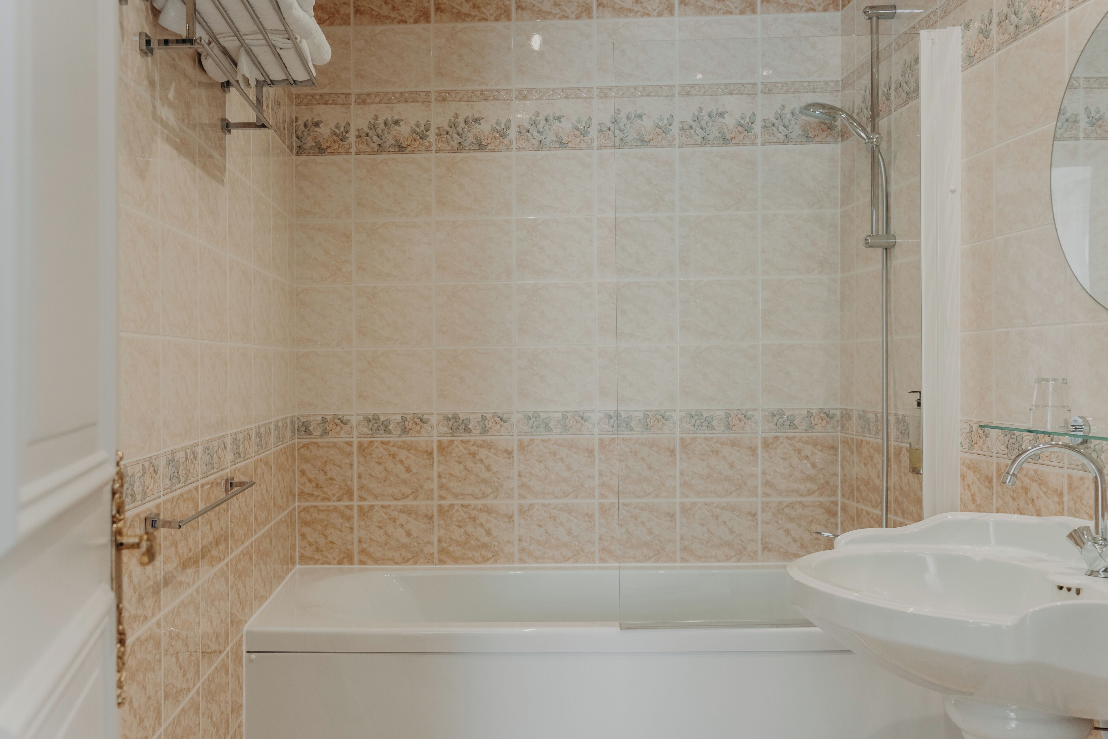 A bathroom with a bathtub, a sink, and a shower.