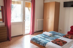 Classic Triple Room, Multiple Beds, Shared Bathroom, Park View | Minibar, desk, free WiFi, bed sheets
