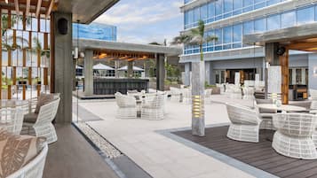 Outdoor pool, open 6:00 AM to 10:00 PM, pool umbrellas, sun loungers