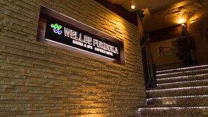 A sign for 'WELLBE FUKUOKA' indicating a spa and hotel. - Executive Spa & Capsule WELLBE Fukuoka - Caters to Men (Fukuoka)
