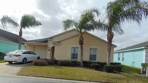 A residential house with a white car parked in the driveway. - Cozy/Spacious House with Private Pool and Lake View (Davenport)
