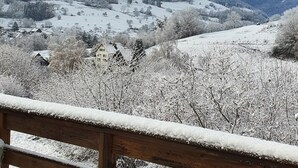 A snowy landscape with a wooden fence in the foreground. - Magnificent chalet in Hohrod/Munster Alsace with panoramic south-facing view  (Hohrod)
