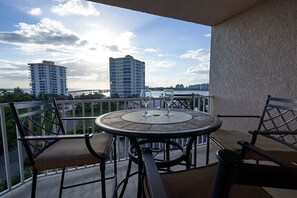 Outdoor dining - Amazing Views & Condo! Heated waterfall Pool & Hot Tub, free wifi and parking! (Fort Myers Beach)