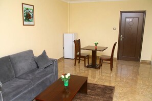 Family Room, Balcony | Living area | 32-inch TV with digital channels - Melodie Hotel (Addis Ababa)