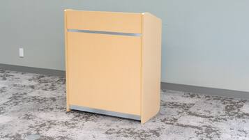A yellow filing cabinet against a light gray wall with a textured floor.