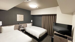 A hotel room with two beds, a television, a desk with a lamp, and a ceiling light. - Hotel Route Inn Osaka Takaishi Hagoromo Ekimae (Takaishi)