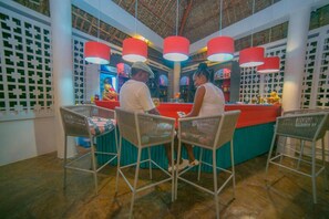 3 bars/lounges, 2 poolside bars, beach bar