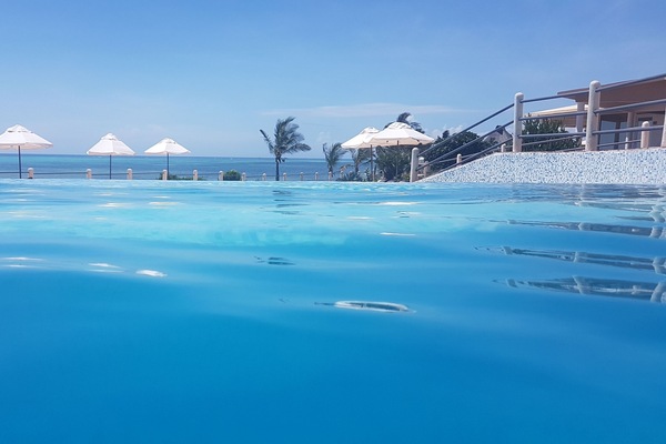 4 outdoor pools, open 6:00 AM to 6:00 PM, free cabanas, pool umbrellas