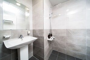 Shower, free toiletries, hair dryer, slippers
