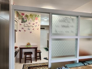 One-Bedroom Apartment | Living area | 43-inch flat-screen TV with cable channels, TV
