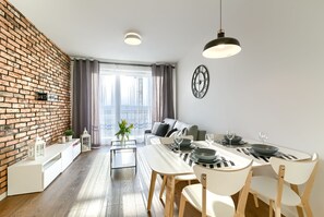 Comfort Apartment | Living area | Flat-screen TV