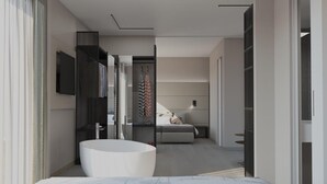 A modern bathroom with a freestanding bathtub, a large mirror, and a walk-in shower. - Hotel Venice Beach (San Michele al Tagliamento)