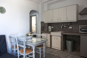 Traditional Apartment, 2 Bedrooms, Sea View | Private kitchen | Full-size fridge, stovetop, espresso maker, coffee/tea maker - Portes View House (Paros)