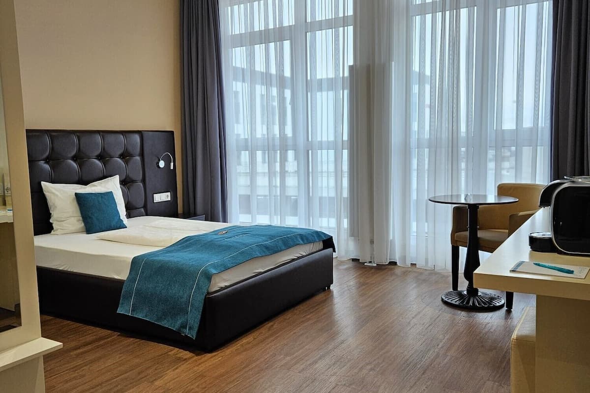 economy single room | premium bedding, in-room safe, desk, laptop workspace