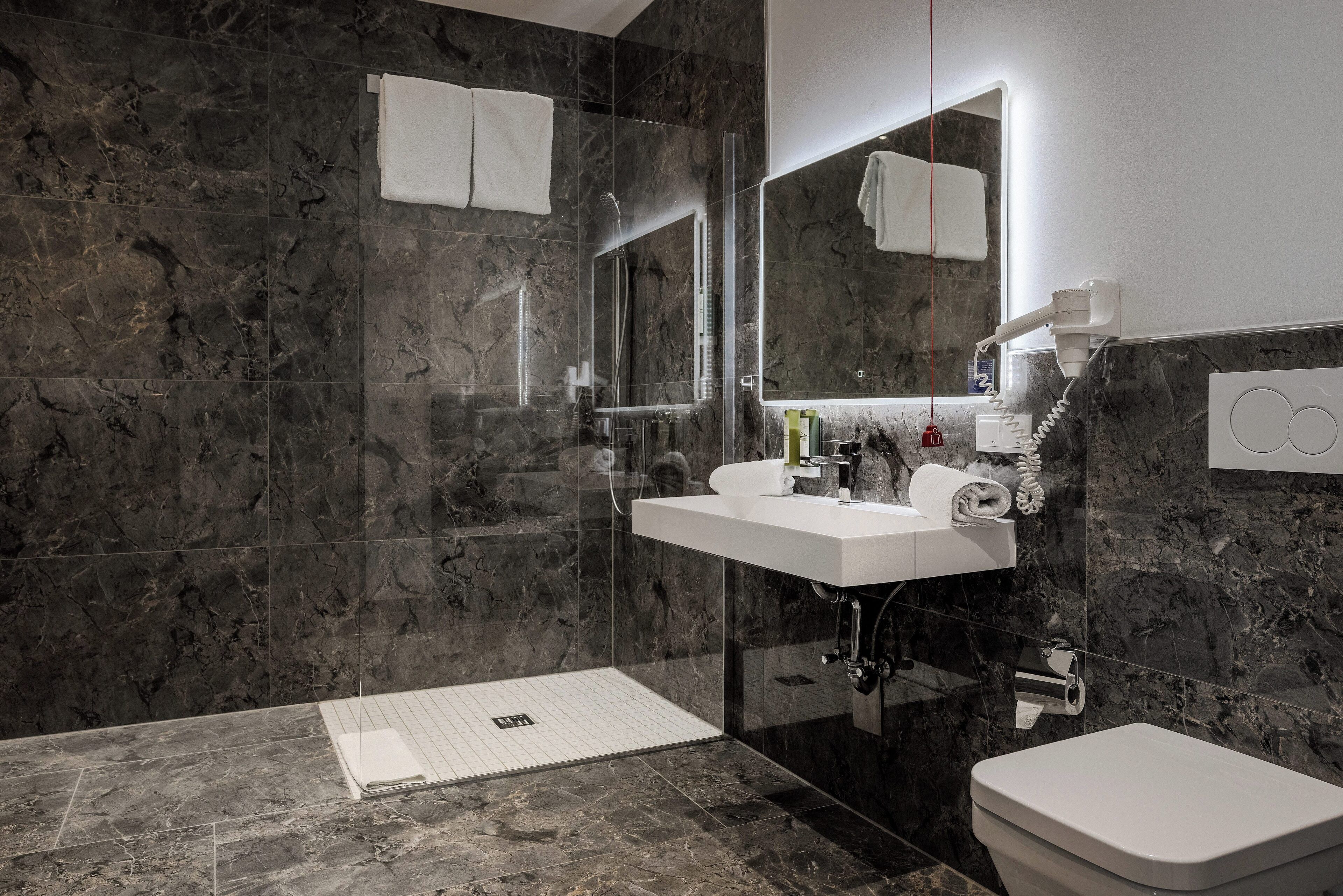 junior studio suite | bathroom | free toiletries, hair dryer, towels, soap