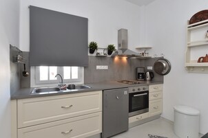 Apartamento, 2 habitaciones | Cocina privada | Frigorífico, horno, placa de cocina y máquina de café espresso