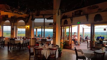 2 restaurants, breakfast, lunch, dinner served; local cuisine