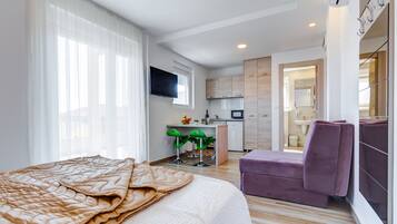 Luxury Apartment, Sea View | Living area | Flat-screen TV