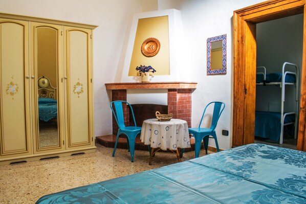 Chambre quadruple | Literie de qualité, minibar, bureau, système d’insonorisation