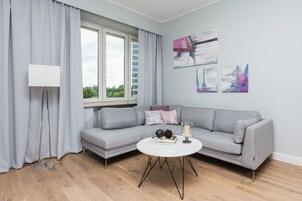 Deluxe Apartment, 2 Bedrooms | Living room | Flat-screen TV
