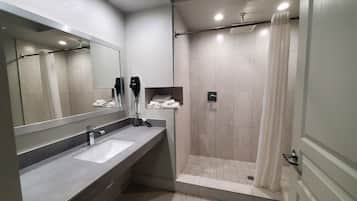 Combined shower/bathtub, deep-soaking bathtub, towels
