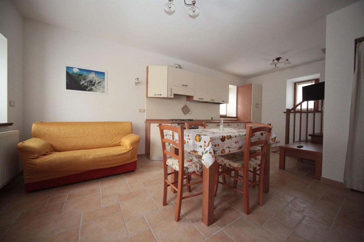 Apartment, 1 Bedroom (Lesca) | Living area | Flat-screen TV