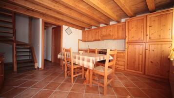 Apartment, 1 Bedroom (Alpina) | Living area | Flat-screen TV