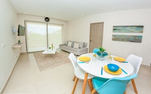 Deluxe House, 2 Bedrooms, Poolside | Living area | Flat-screen TV