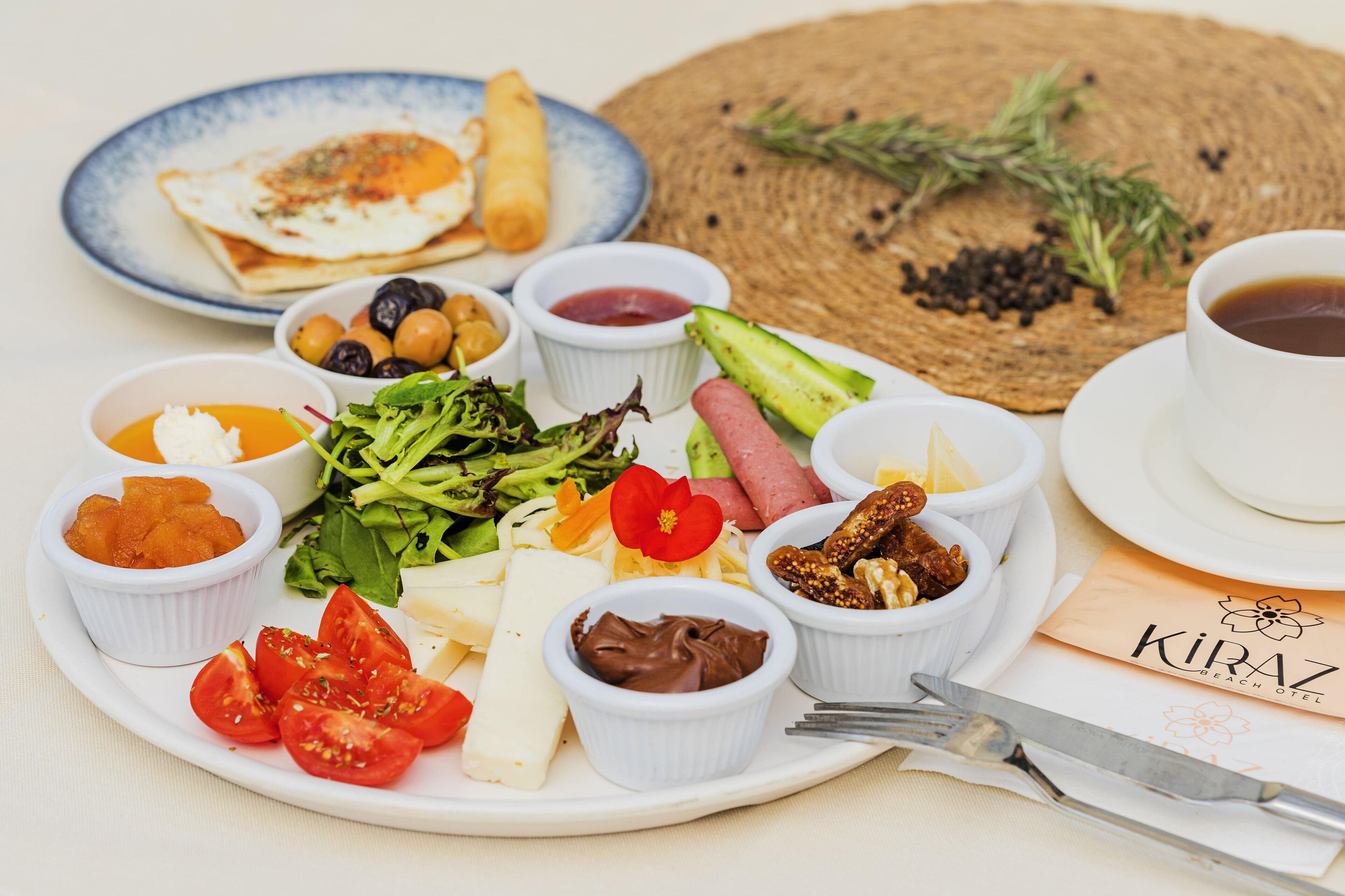 A breakfast plate with various foods and a cup of coffee.