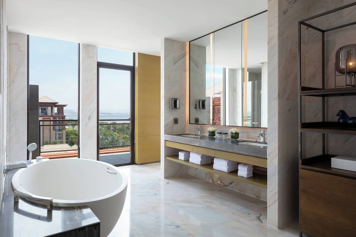 separate bathtub and shower, deep-soaking bathtub, rainfall showerhead