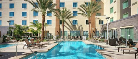 Outdoor pool, open 8:00 AM to 10:00 PM, sun loungers