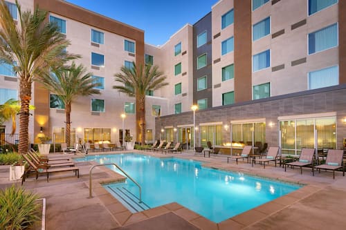 Outdoor pool, open 9:00 AM to 10:00 PM, pool umbrellas, pool loungers